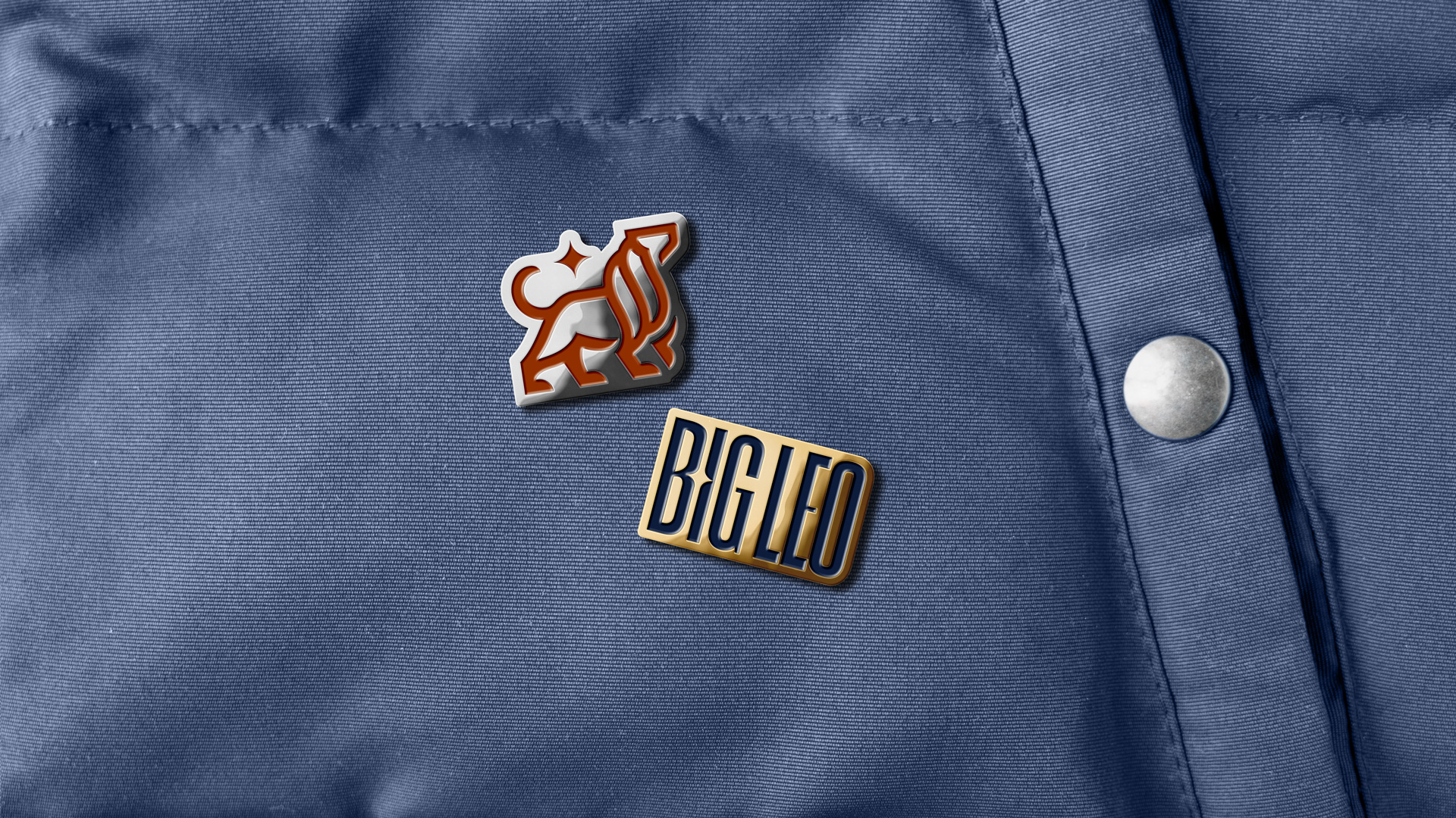 Big Leo enamel pins with wordmark and lion logo.