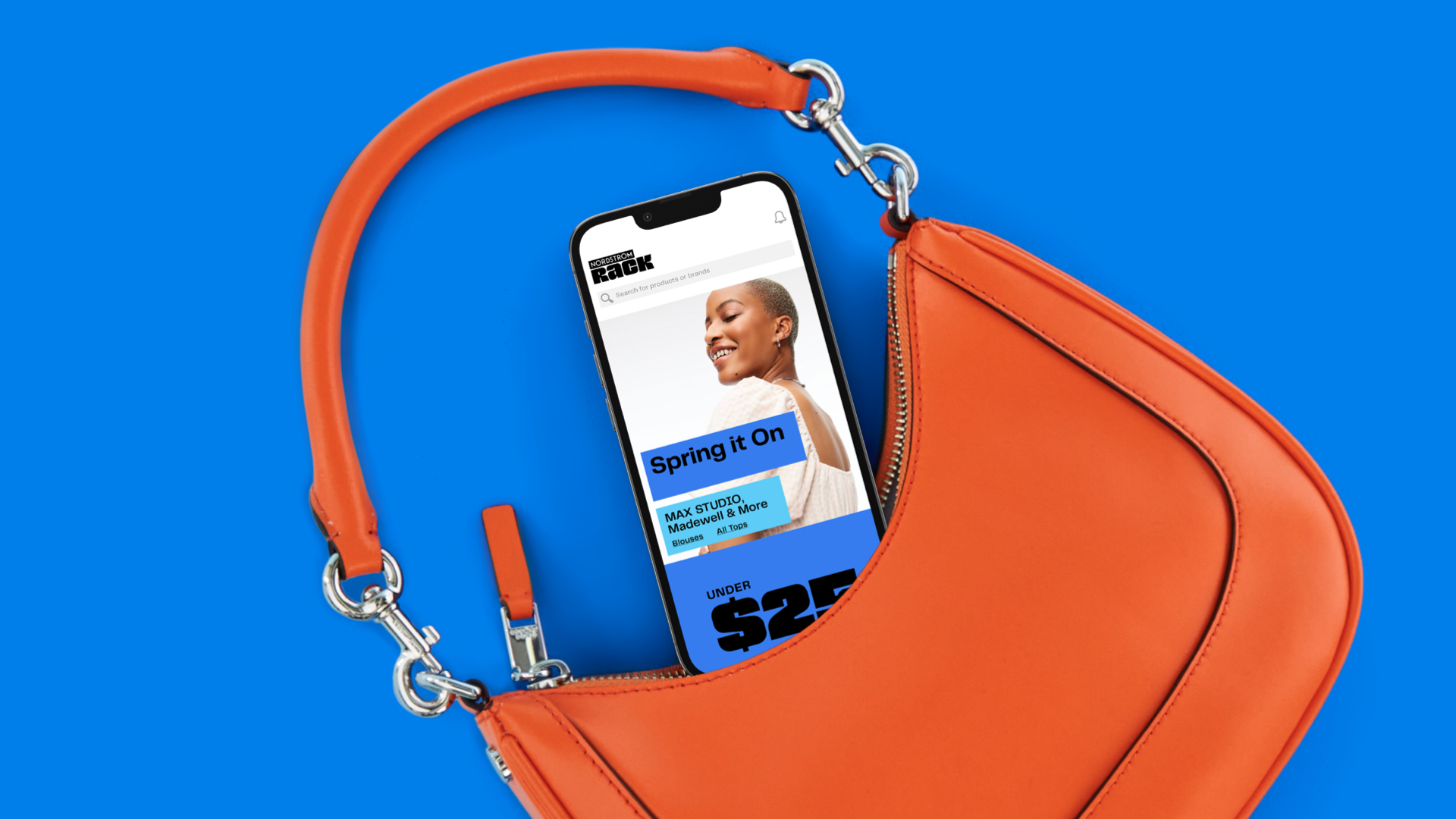Nordstrom Rack mobile website viewed on a phone sticking out of an orange purse.