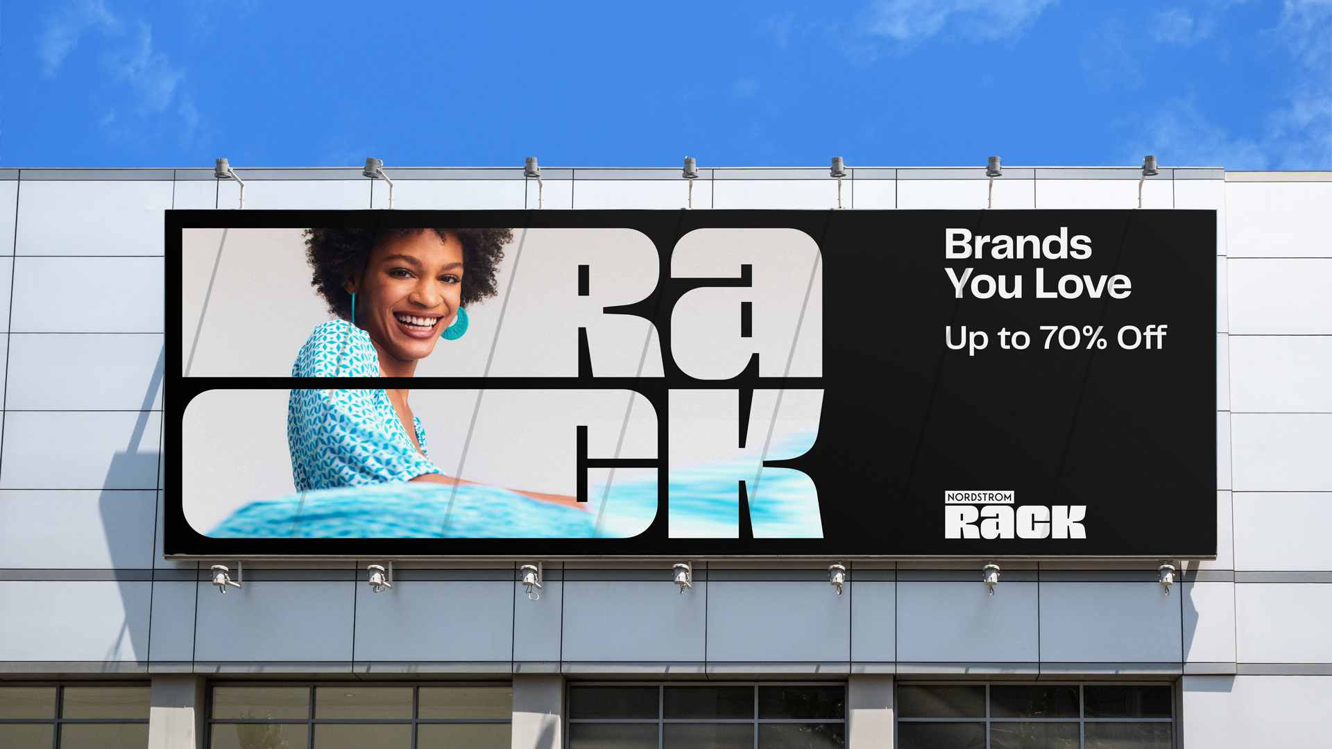 Nordstrom Rack billboard with fashion photography and modular logo.