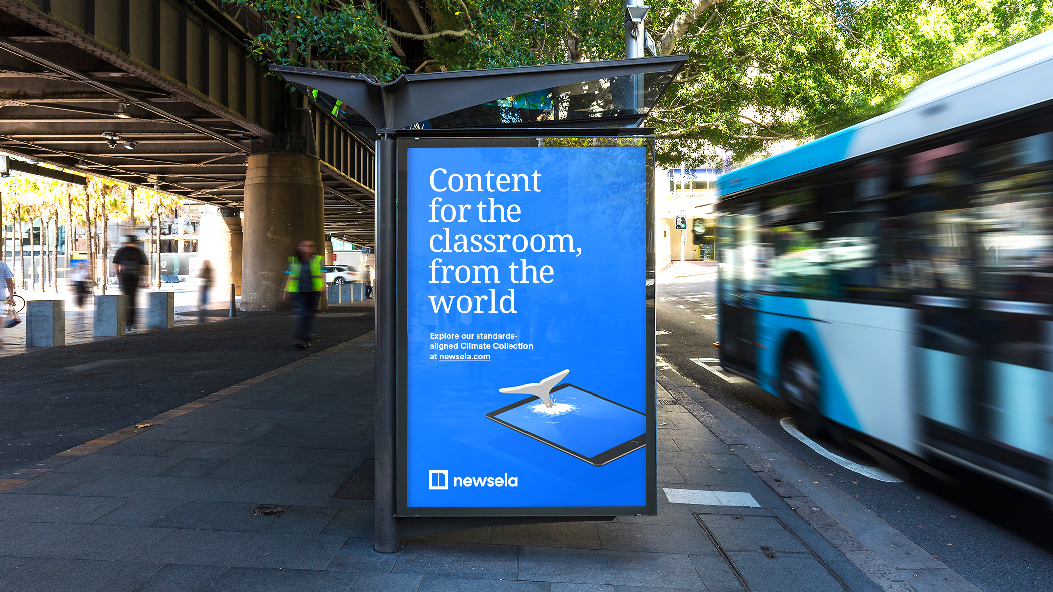 Newsela bus shelter ad with whale illustration.
